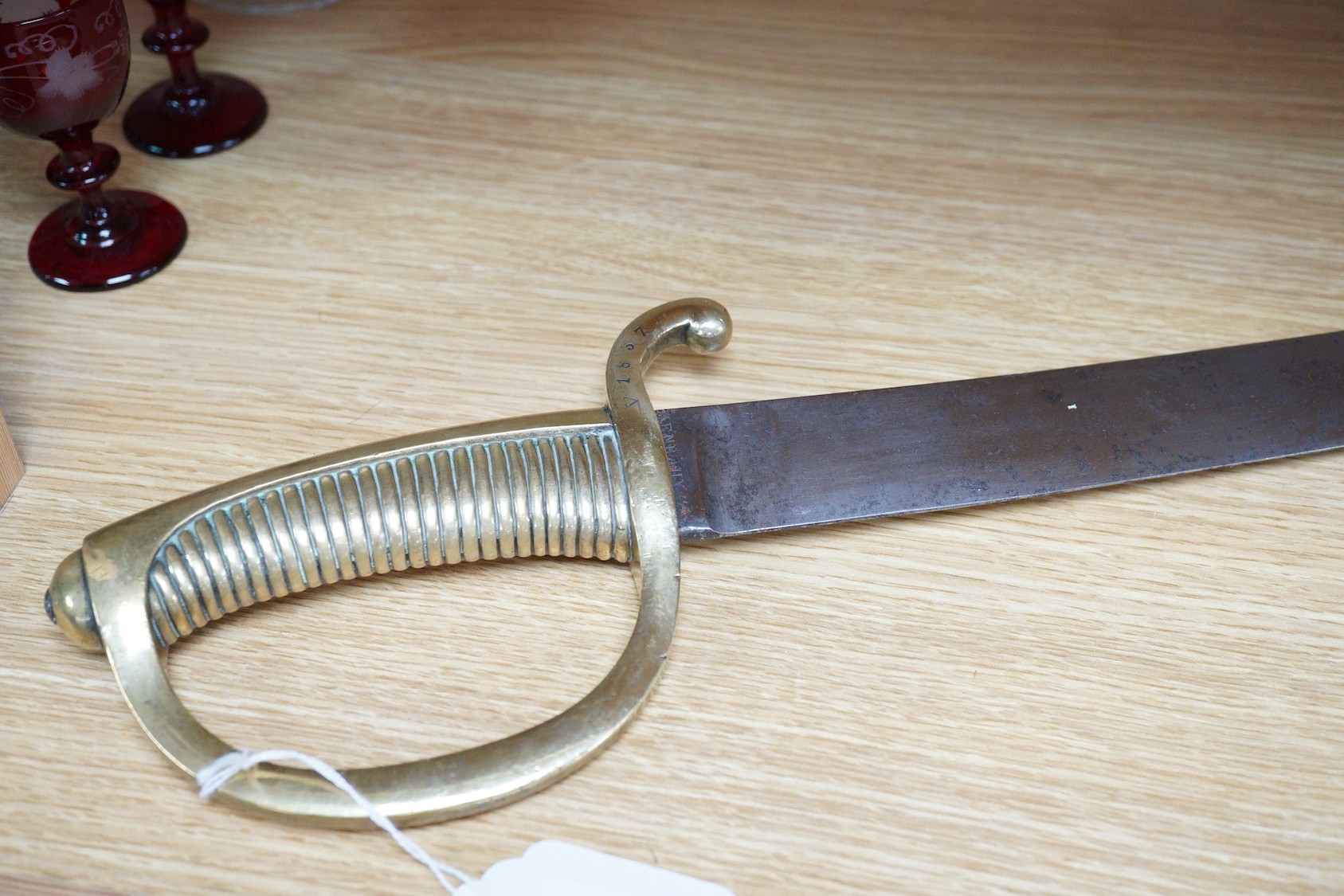 An early 19th century French sabre, the blade stamped HENRAUX, 73cm long